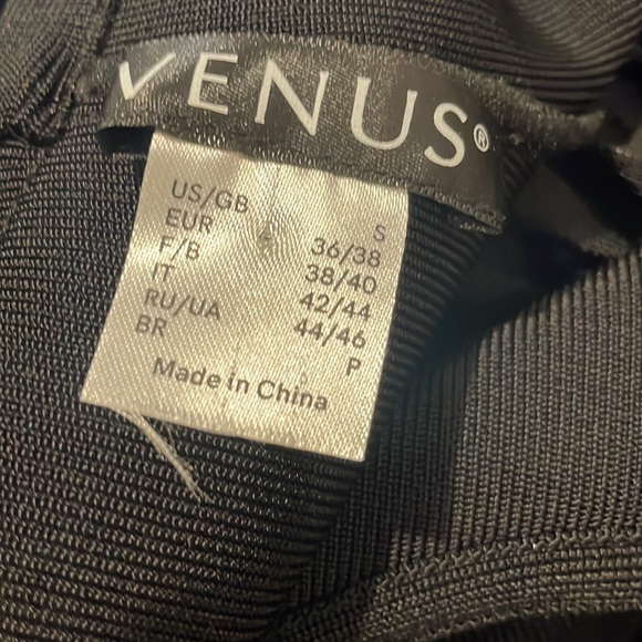 This beautiful black tie dress is 86% Rayon 12% Nylon and 2% spandex. - Picture 3 of 3